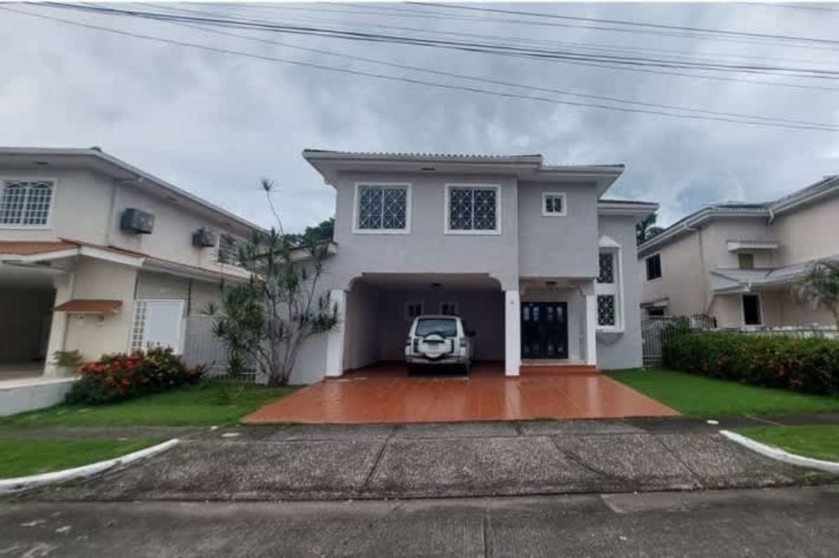 Two-story spacious house front facade with parking area in Margarita Colon Panama