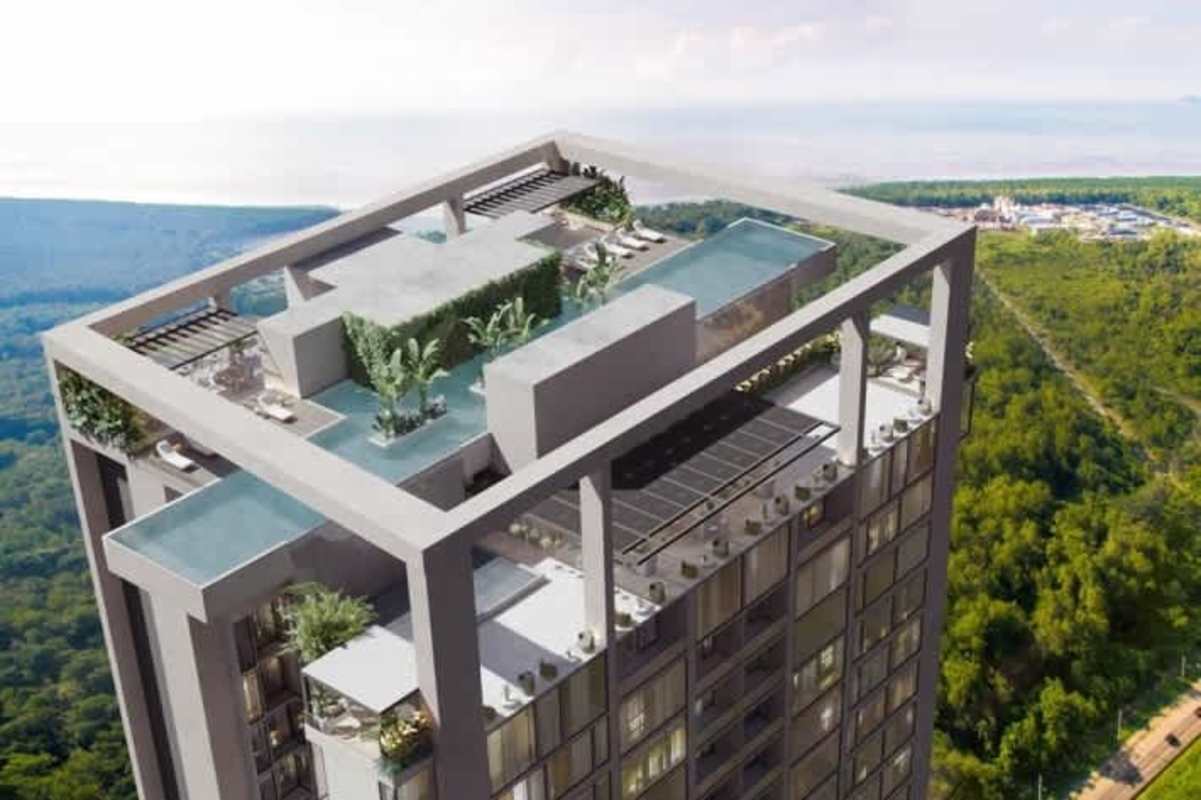 Aerial photo of PH The Ivy tower with city skyline and golf landscaping in Panama City