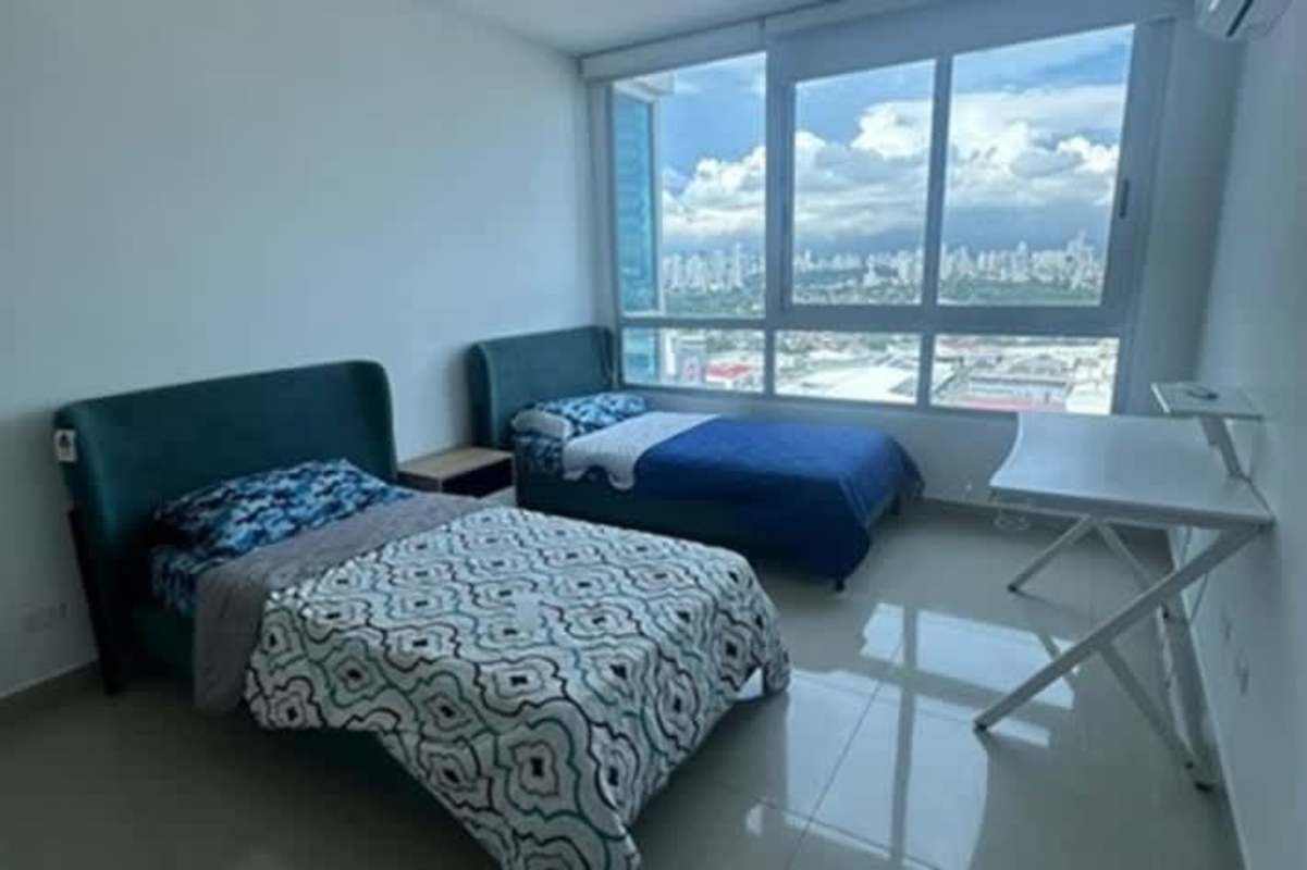 Modern guest bedroom with natural light and city views in PH Mirador Costa del Este