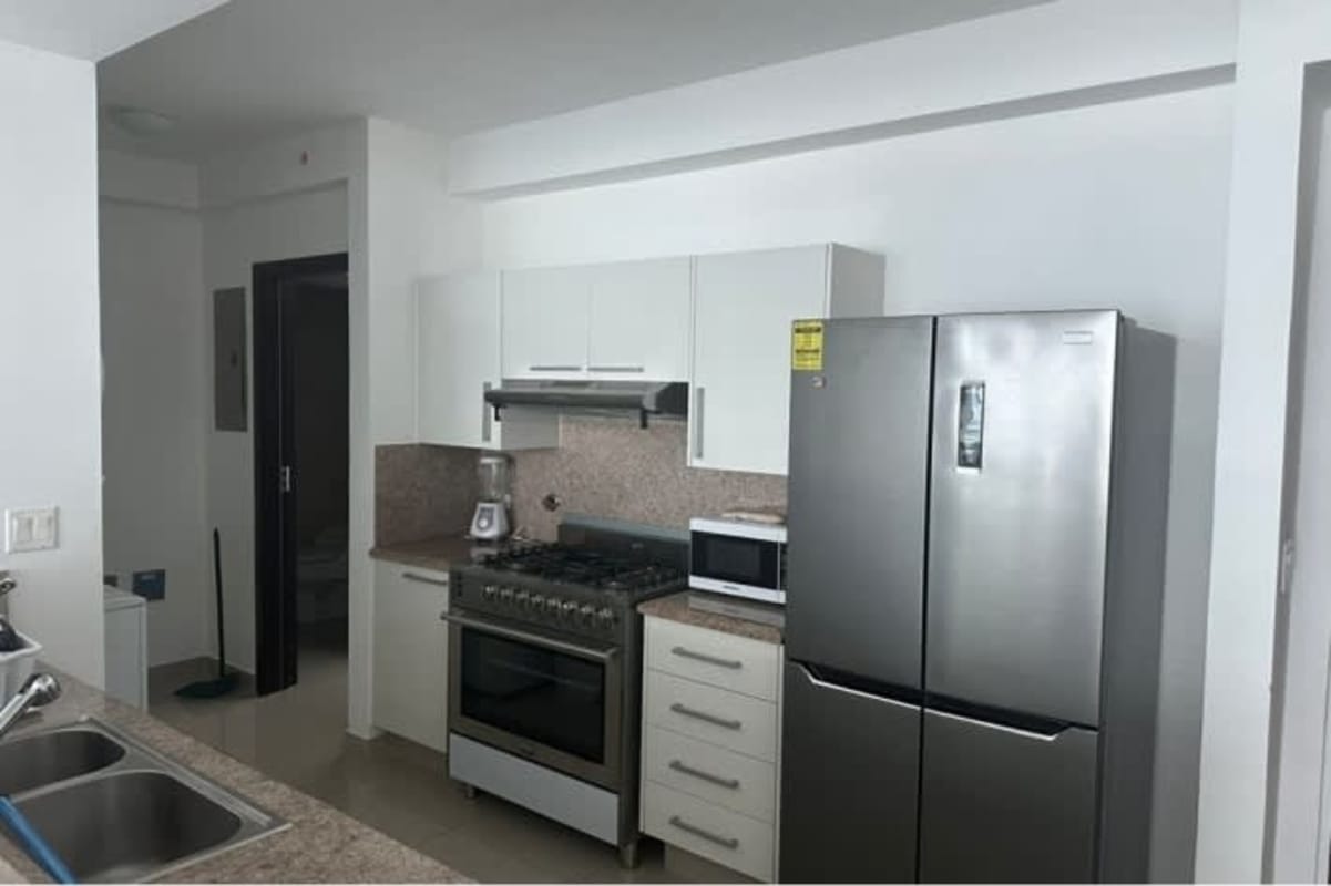 Fully equipped modern kitchen with granite countertops and stainless appliances in PH Mirador Costa del Este