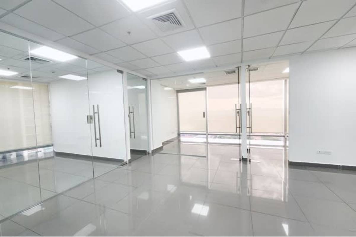 Vacant modern office space airy bright glass partitions large windows at Costa del Este Panama