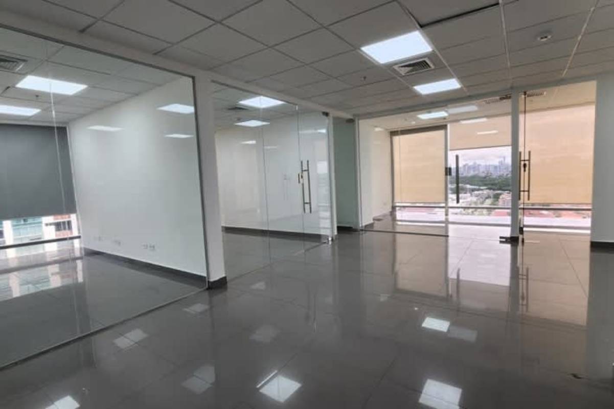 Empty bright office space with large windows glass walls tiled floors in Costa del Este