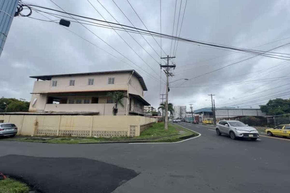 Street corner view of multi-use two-story commercial educational building in Panama City