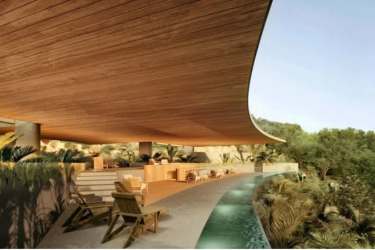 Modern villa with curved wooden roof infinity pool and natural landscaping at Playa Venao Pedasi