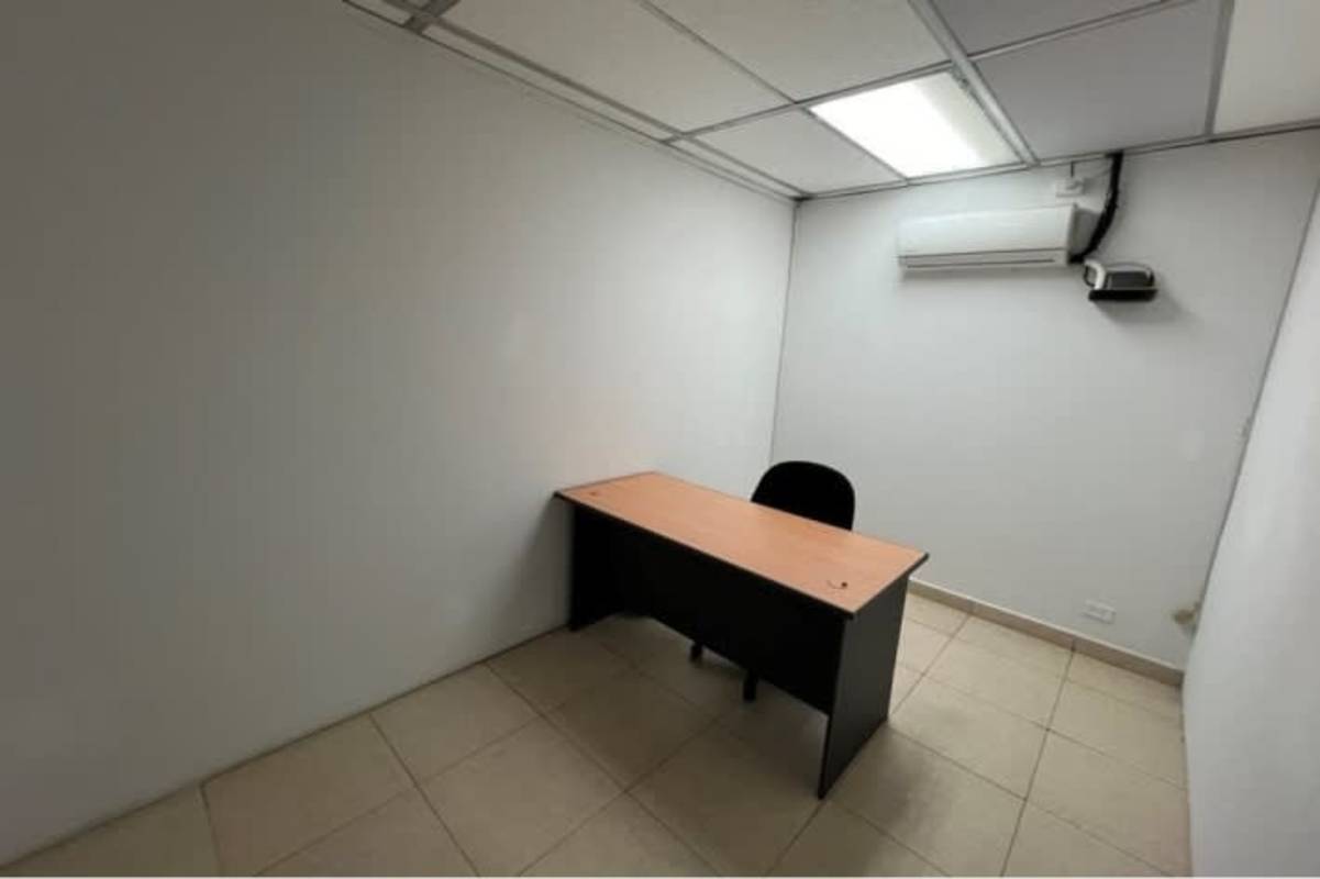 Office room with desk, shelves, drop ceiling, tile floor and window in Bella Vista Panama