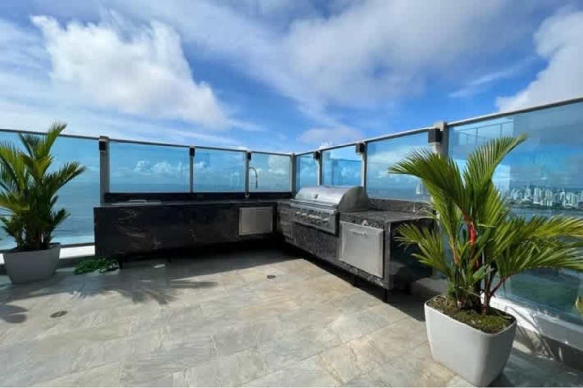 Luxurious master bedroom with panoramic ocean views, marble floors, elegant fixtures in PH Costanera Costa del Este Panama