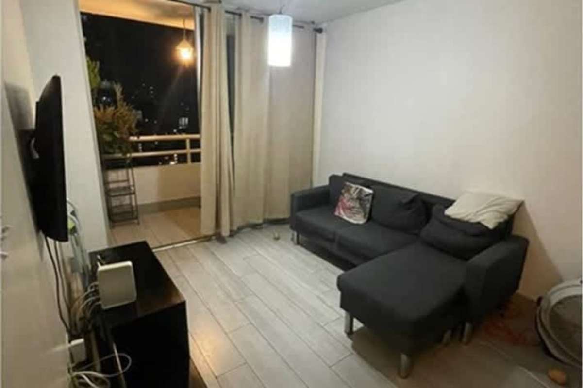 Modern living room with sectional sofa and balcony access in PH Splendor By The Park Carrasquilla Panama City