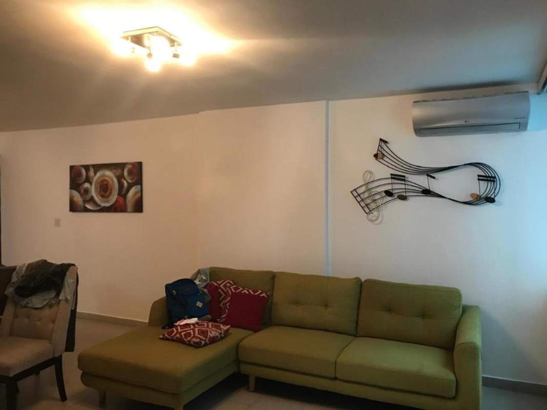 Modern kitchen with stovetop oven and frosted glass cabinets in PH Obarrio Panama