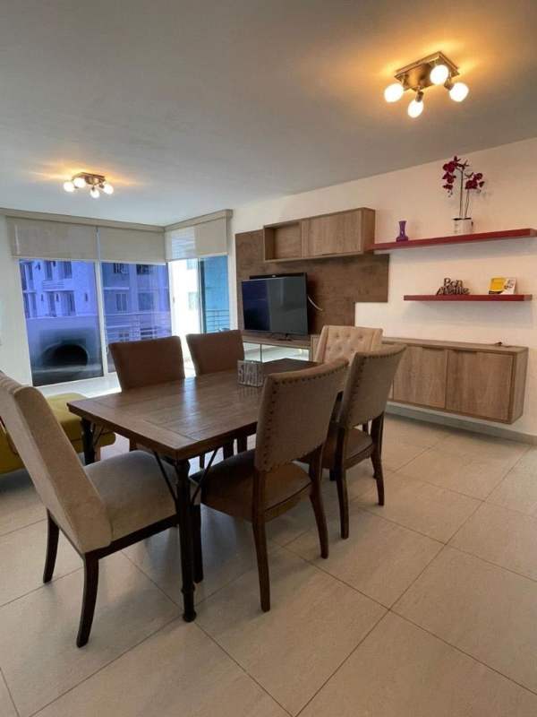 Spacious living dining area with large windows Obarrio Panama apartment
