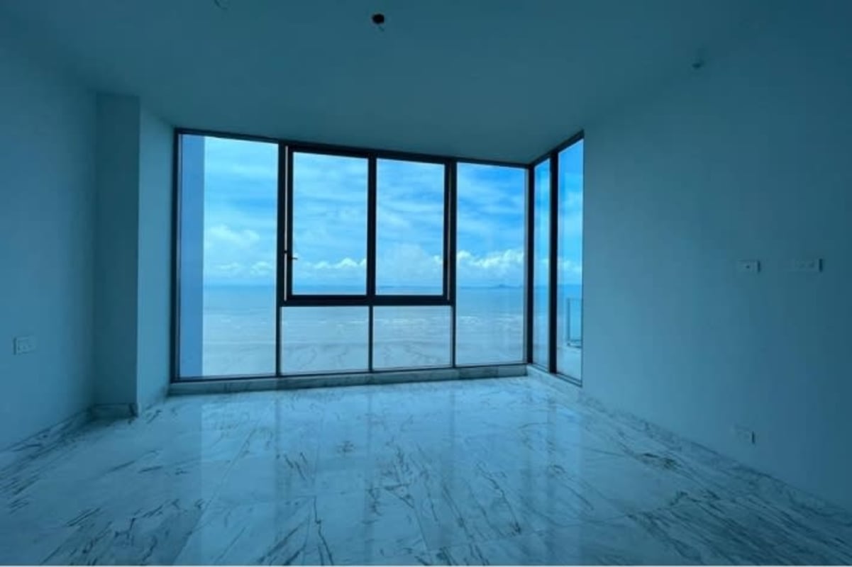 Spacious bedroom with large window, marble floors, city skyline view Costa del Este Panama