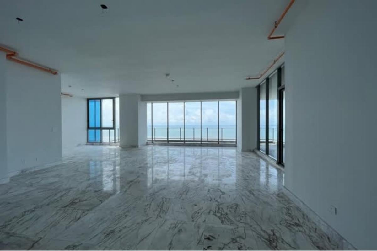 Walk-in closet with built-in shelving, marble floors in oceanfront penthouse Costa del Este Panama