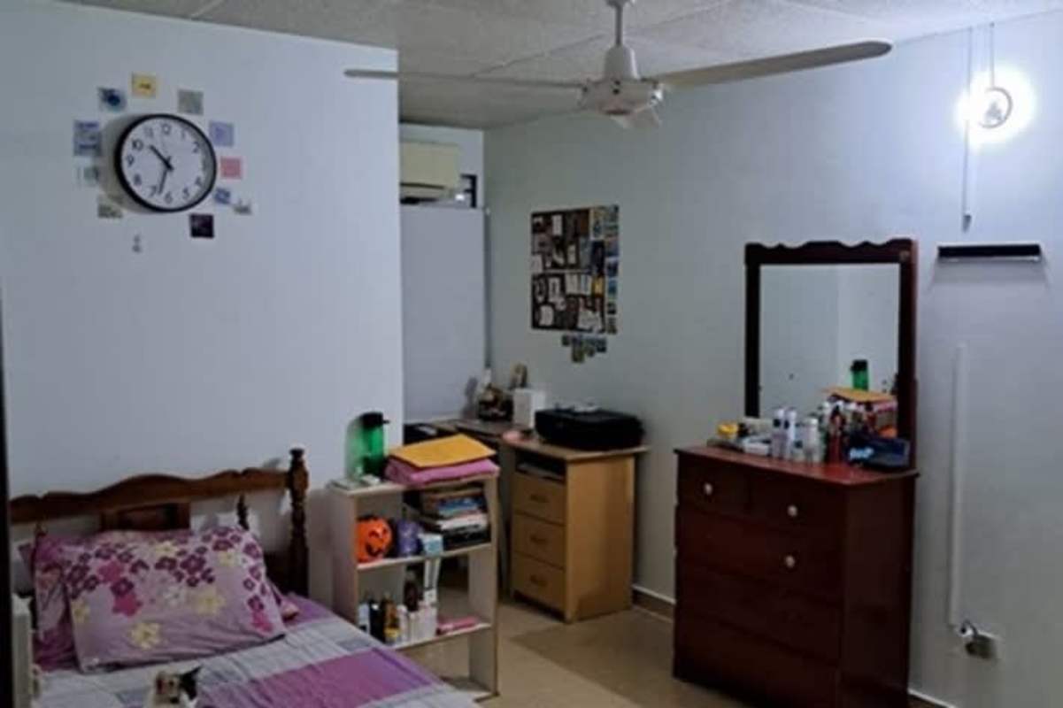 Simple bedroom with wardrobe, fan, mirror in Las Americas Panama City
