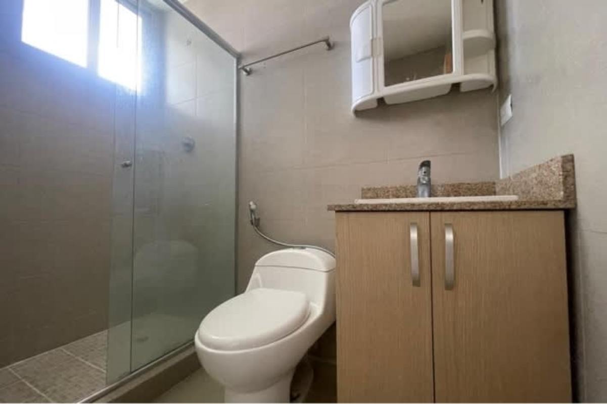 Minimalist bathroom with glass shower granite countertop Panama