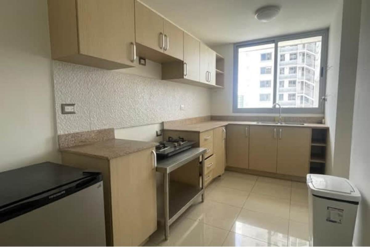 Bright bedroom with built-in wardrobe overlooking city skyline Panama