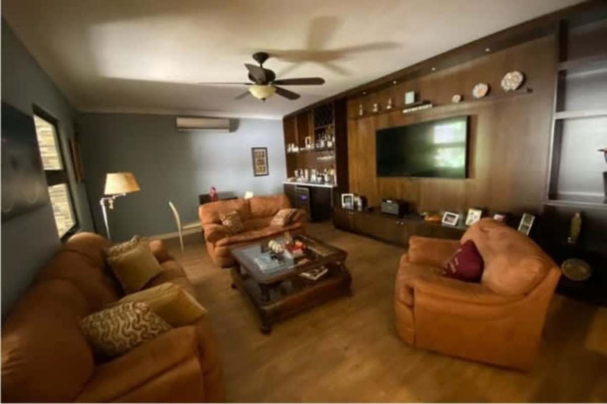 Spacious dining area with glass table and outdoor view luxury duplex Costa del Este Panama