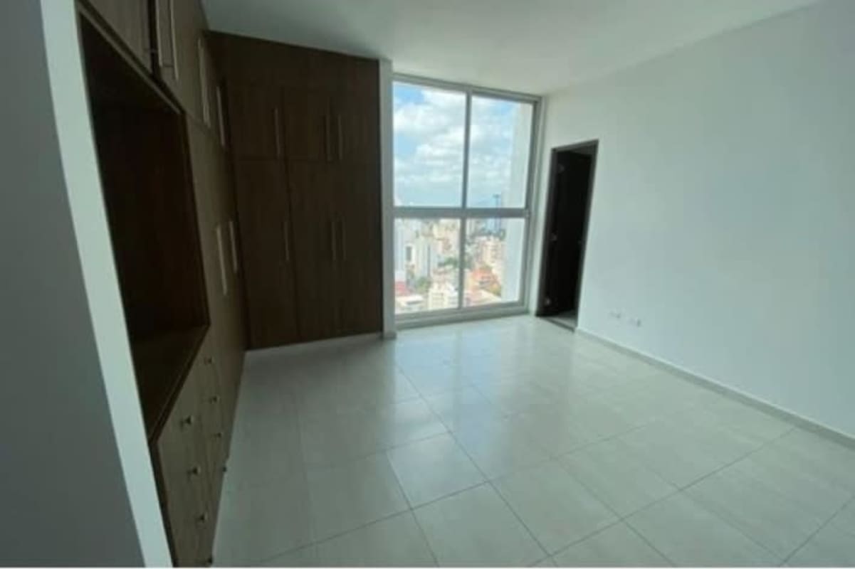 Bedroom with built-in wardrobe and large window in PH El Cangrejo Bella Vista Panama
