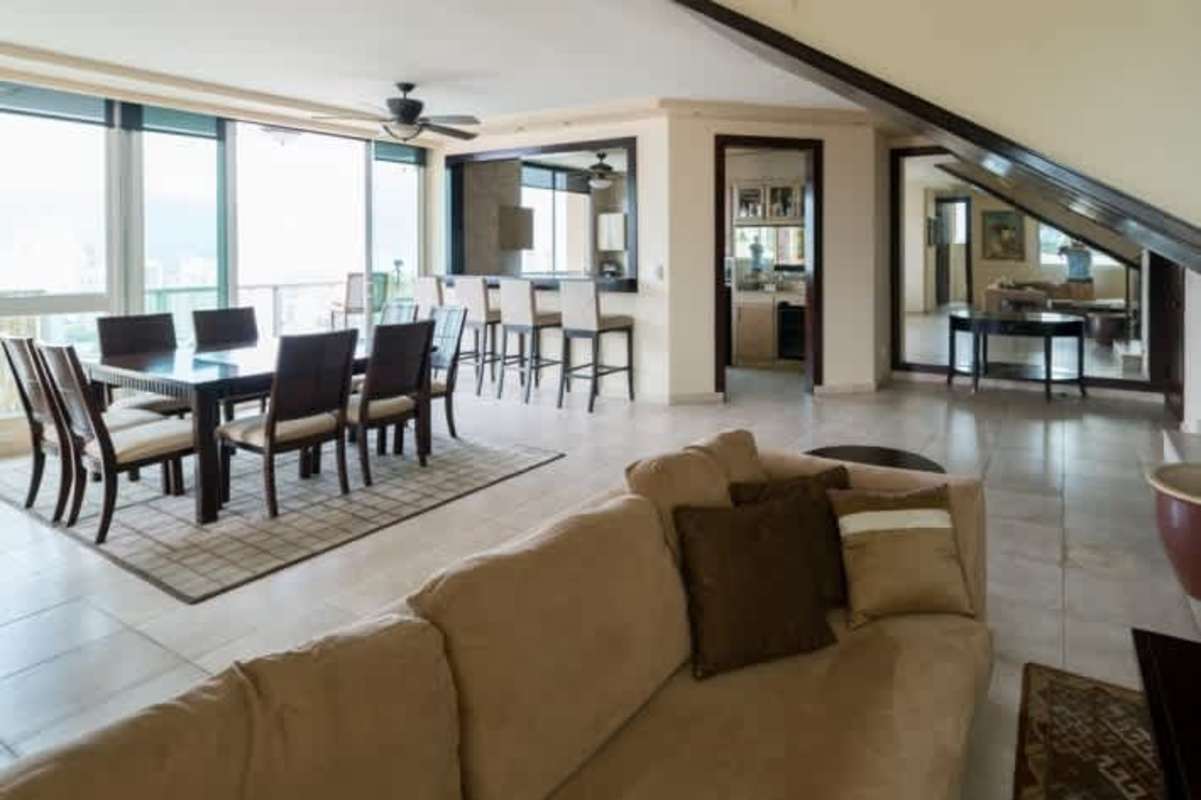 Large master bedroom with windows and city skyline views in Mystic Point Towers Punta Pacifica Panama