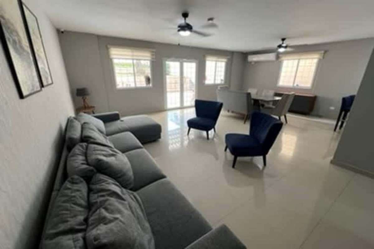Spacious open plan living and dining in Urbanization El Doral with natural light and modern finish