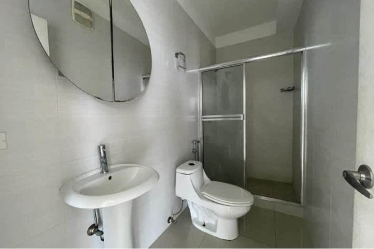 Modern secondary bathroom glass shower granite sink El Cangrejo Suites Panama