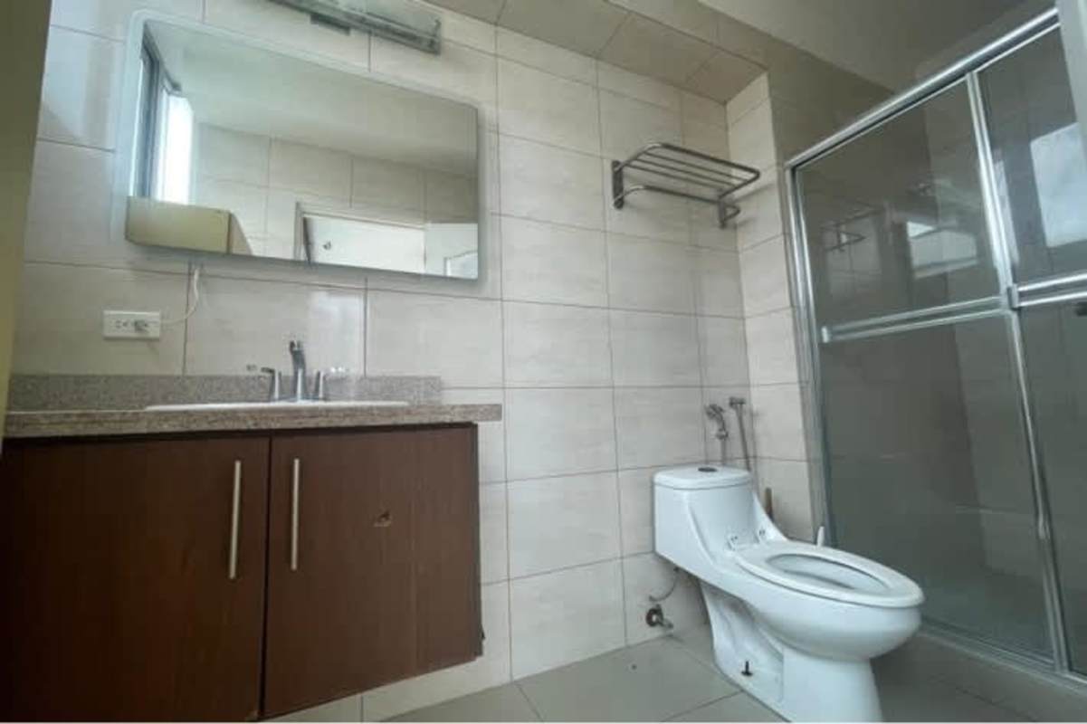 Modern bathroom granite countertop and glass shower PH El Cangrejo Suites Panama City