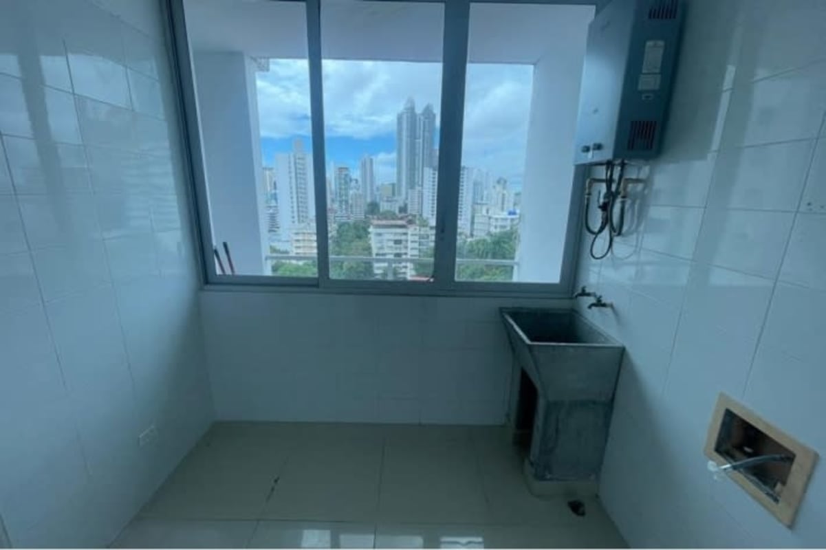 Laundry area with window city skyline utility sink PH El Cangrejo Panama