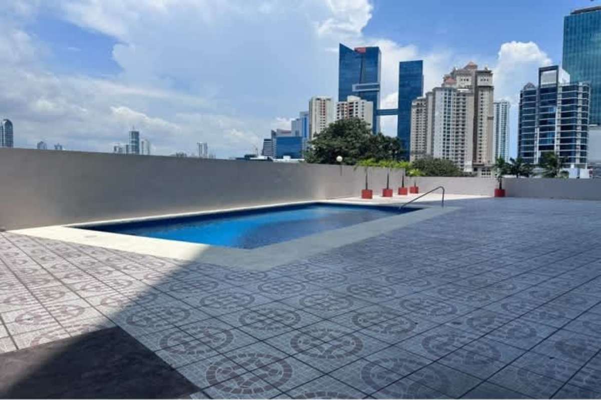 Outdoor pool on rooftop terrace with skyline views at Punta Paitilla Panama City