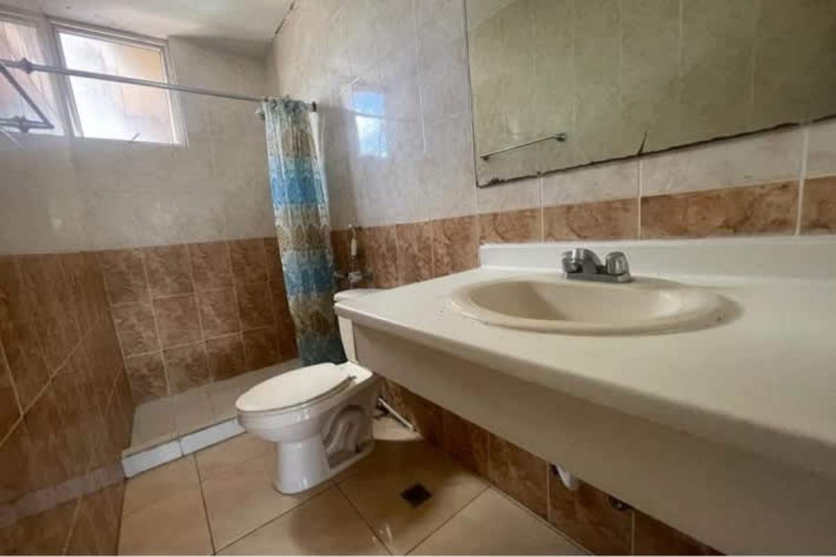 Modern bathroom tiled walk-in shower vanity PH Serenity Tower Panama City