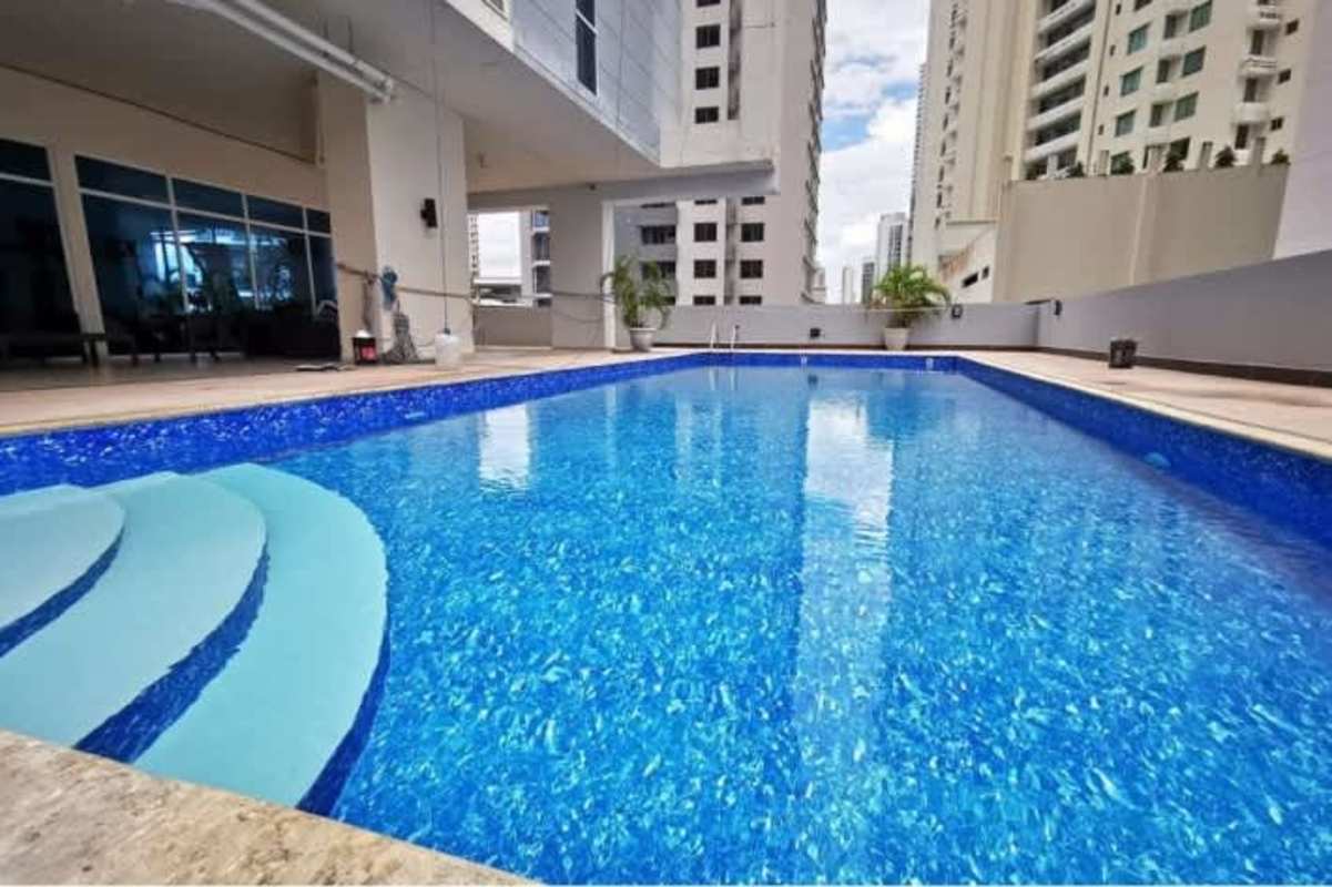 Outdoor children's playground with colorful mural at PH Blue Park Bella Vista Panama City