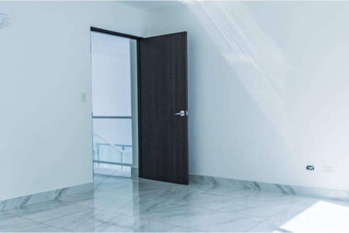 Swimming pool surrounded by high-rise condos at PH Blue Park Bella Vista Panama