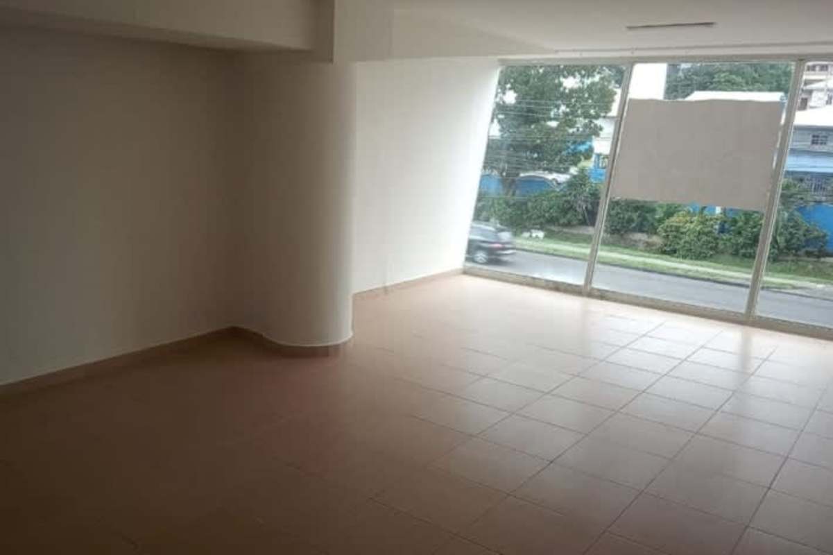 Minimalist empty commercial office interior with white walls, tiled floors and window
