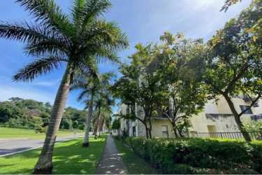 Spacious covered balcony with garden views in Boulevard Panama Pacifico apartment