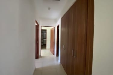 Spacious walk-in closet with built-in organizers in master bedroom Panama Pacifico