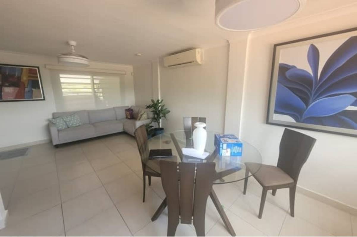 Open concept living dining with AC, fan, tile floors Limajo San Miguelito home