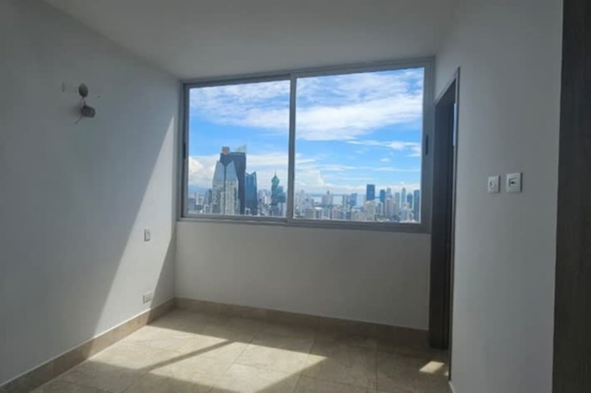 Corner window bedroom city skyline view Bella Vista Panama apartment for sale