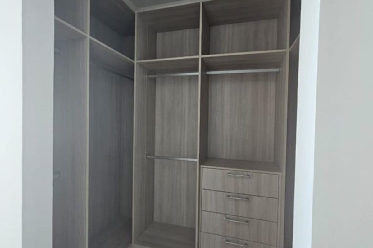 Contemporary built-in wardrobe wood finish Bella Vista apartment Panama