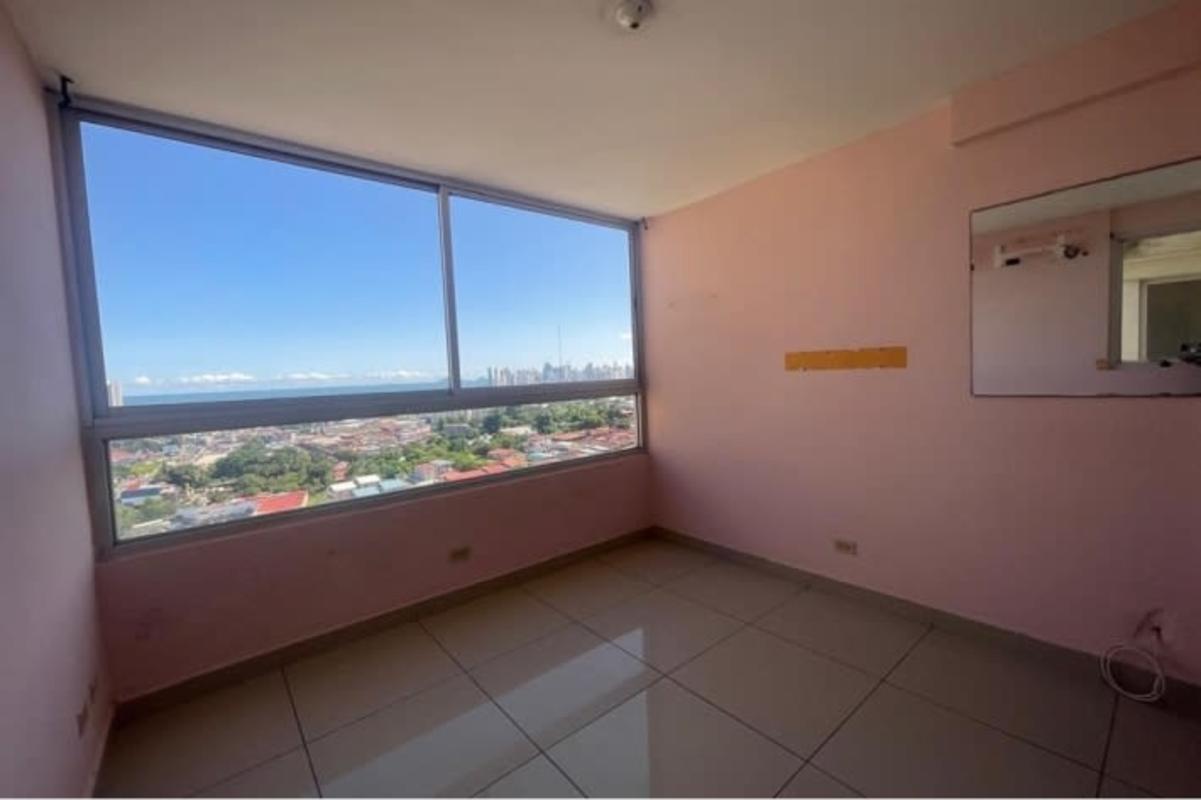 Bedroom with panoramic window, pink walls, ocean skyline view PH Avenida Cincuentenario Panama