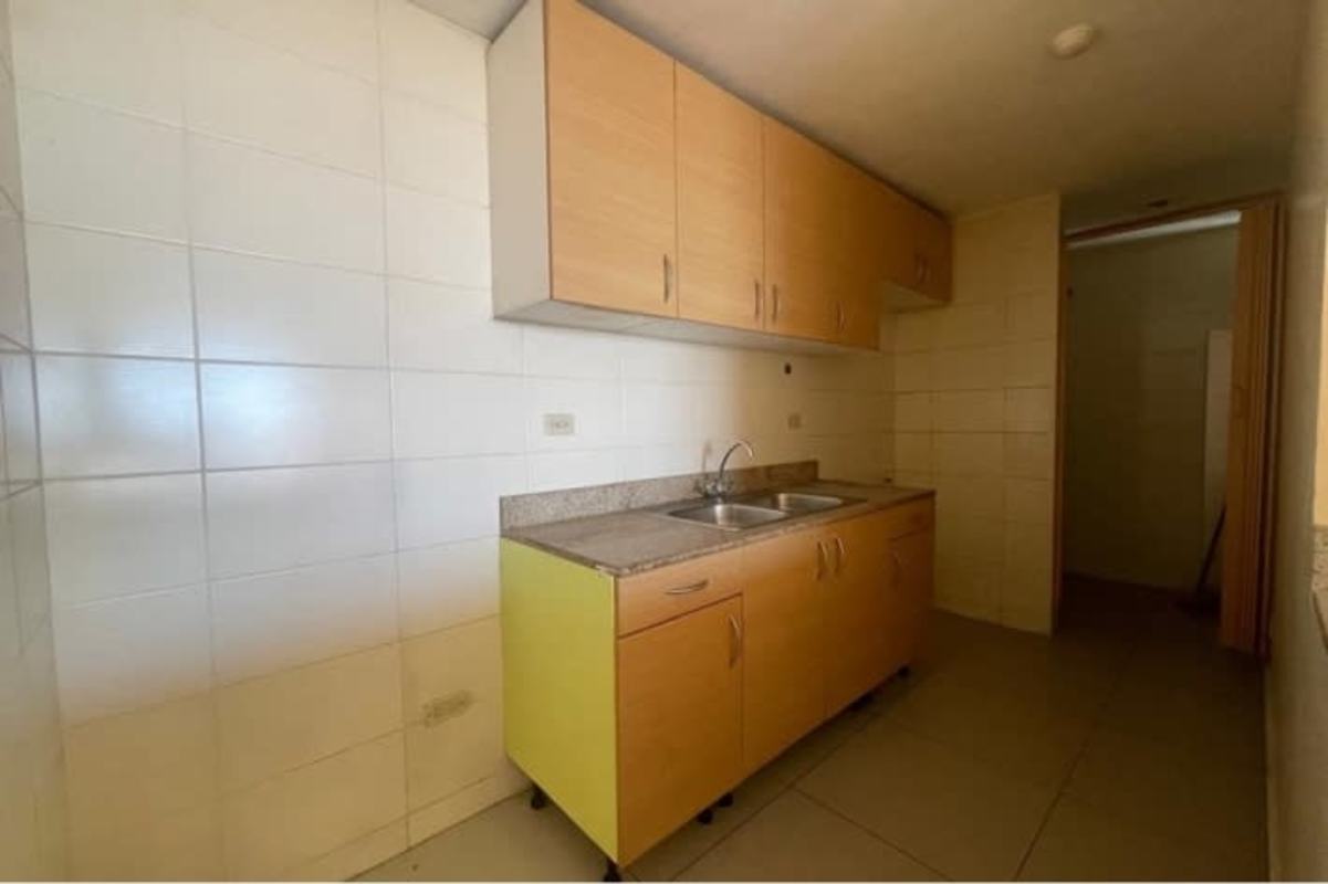 Compact kitchen with granite counter top and cabinets in PH Avenida Cincuentenario Panama City