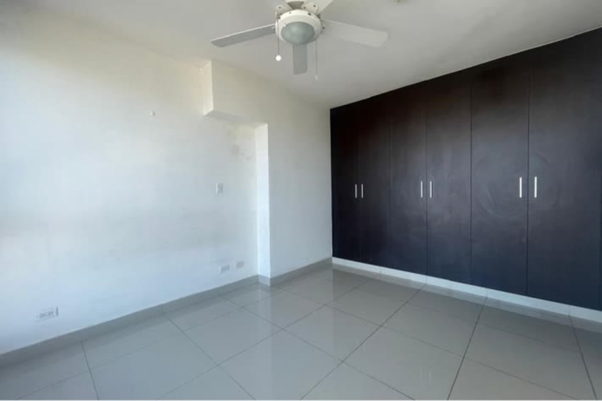 Modern kitchen with built-in cabinets granite counters and double sink at PH Torres de La Loma Panama