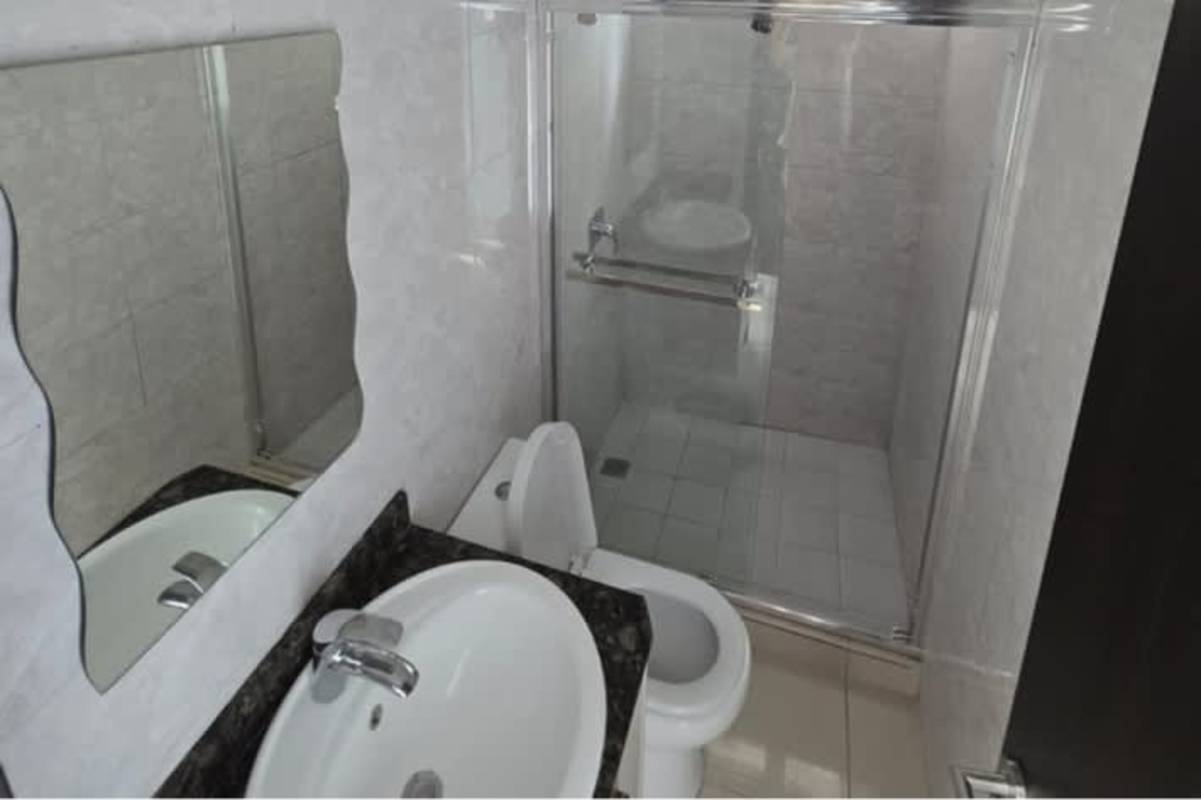 Contemporary bathroom with glass shower, granite countertop, tile walls in PH Park Point