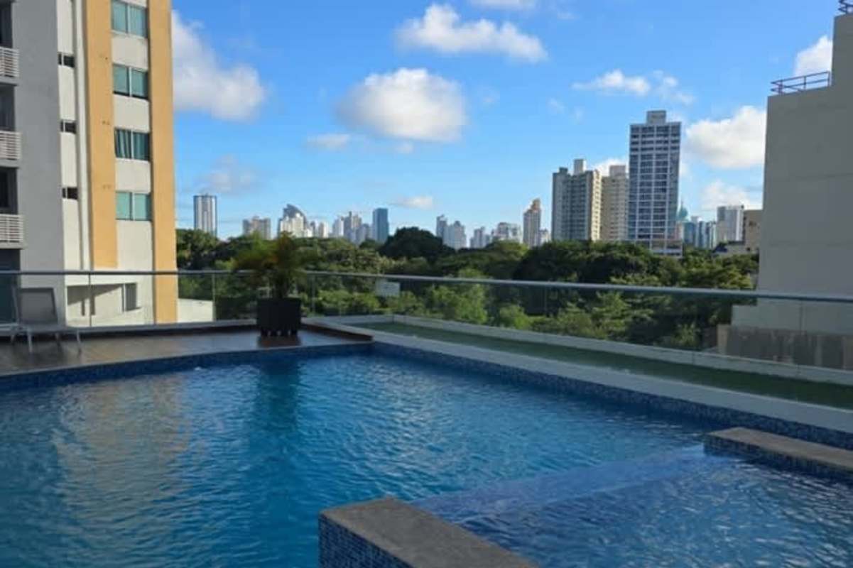 Rooftop pool and lounge area overlooking city skyline PH Park Point