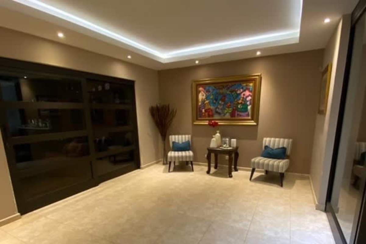Dining room with sliding doors, AC unit, modern decor at Palmeras del Este house