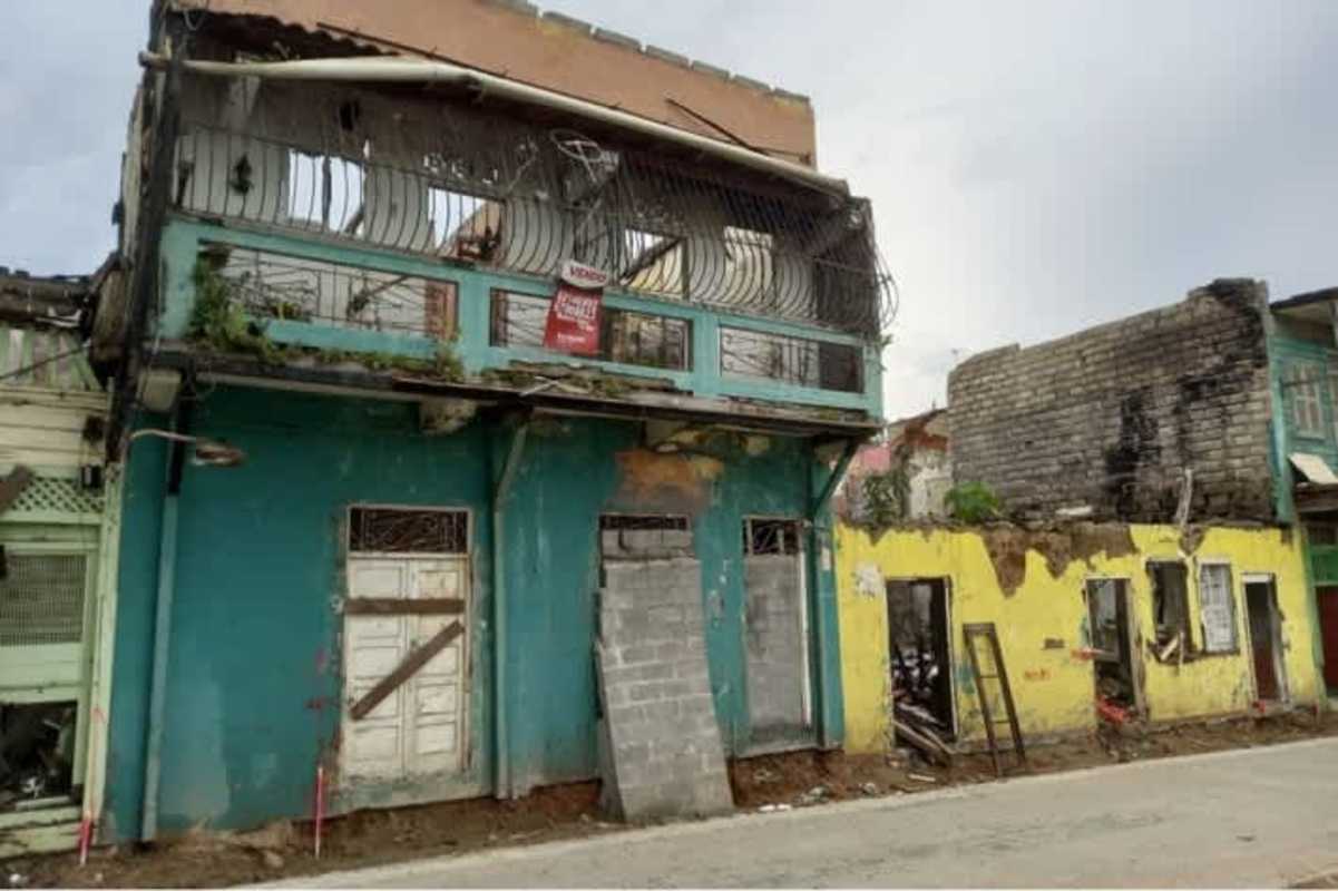 Dilapidated colonial house with collapsed parts and graffiti near Panama City's historic center