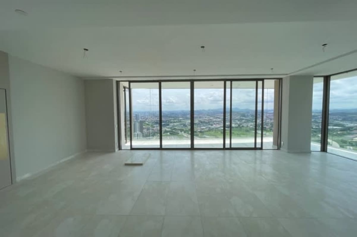 Spacious glass balcony overlooking skyline, ocean, golf at Santa María Panama