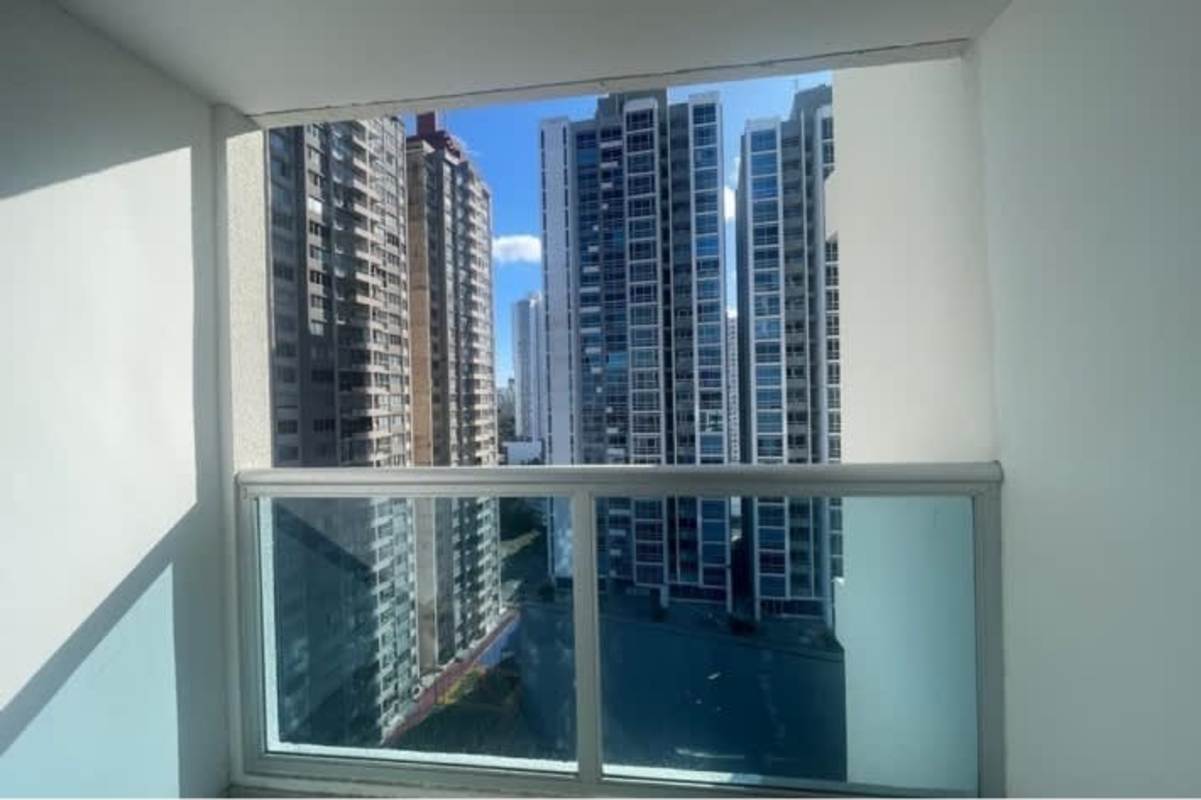 Modern living room with floor-to-ceiling windows and balcony access PH Park View Carrasquilla Panama