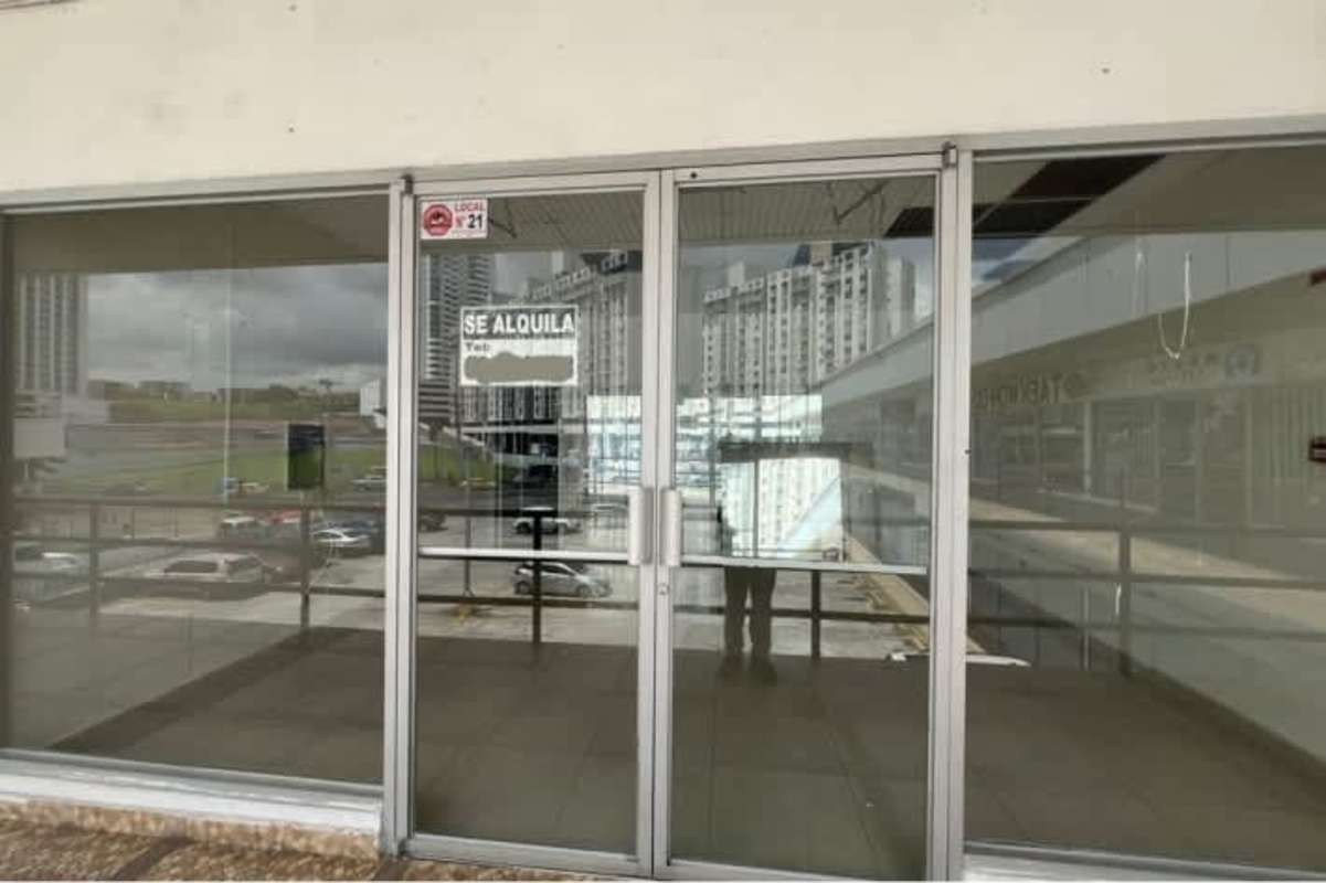 Glass commercial storefront and signage space at Plaza Futuro Panama