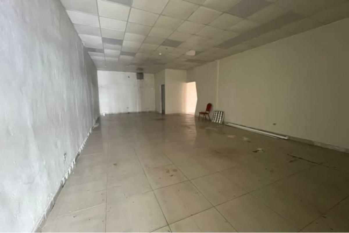 Spacious interior of empty commercial unit with tile floor and drop ceiling Plaza Futuro Panama