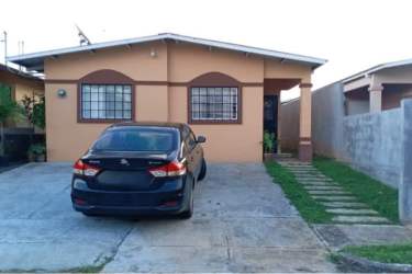 Single story suburban house with garden and driveway Costa Verde La Chorrera