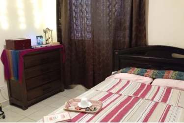 Bedroom with natural light and wardrobe Costa Verde house Panama