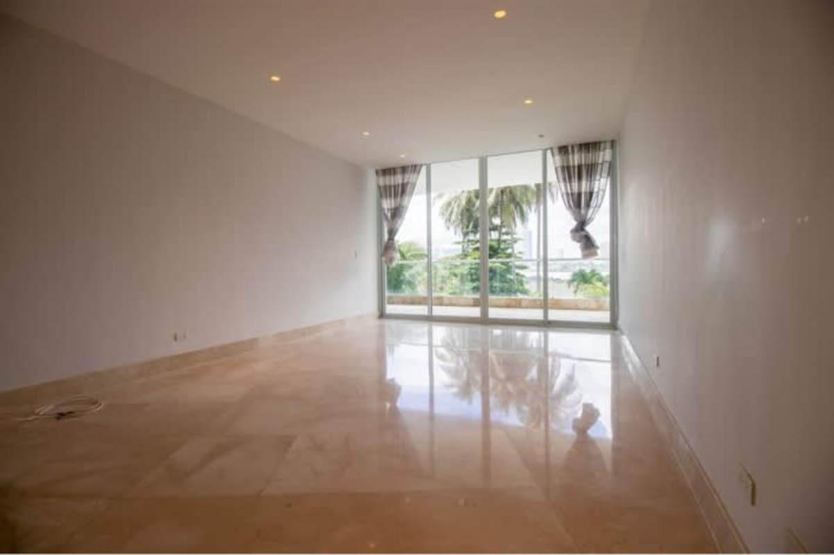 Empty spacious condo living room marble floors large glass windows PH Miradores