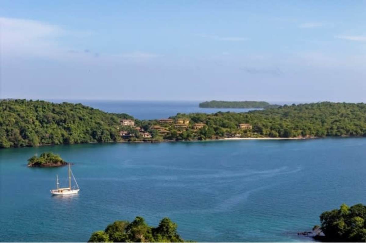 View of tropical beachfront development with marina access surrounded by lush greenery in Las Perlas Islands Panama